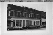 204-210 S MAIN ST, a Queen Anne large retail building, built in Waupaca, Wisconsin in 1884.