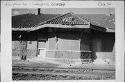 OAK ST, JUST NORTH OF RAILROAD VIADUCT, a Neoclassical/Beaux Arts depot, built in Waupaca, Wisconsin in 1907.