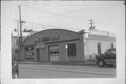 111-117 W UNION ST, a Twentieth Century Commercial automobile showroom, built in Waupaca, Wisconsin in 1919.