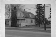 382 N BRIDGE ST, a Dutch Colonial Revival house, built in Manawa, Wisconsin in 1900.