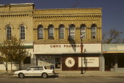 109 E MAIN ST, a Italianate large retail building, built in Omro, Wisconsin in 1871.