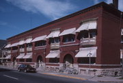 132-140 HIGH ST & 9 BROWN ST, a Romanesque Revival row house, built in Oshkosh, Wisconsin in 1897.