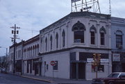 126 N MAIN ST, 5 OTTER AVE, a Italianate small retail building, built in Oshkosh, Wisconsin in 1875.