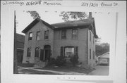 228-230 BROAD ST, a Gabled Ell house, built in Menasha, Wisconsin in 1874.