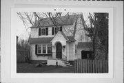 212 ELM ST, a Dutch Colonial Revival house, built in Menasha, Wisconsin in 1931.