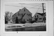 634 RACINE ST, a Dutch Colonial Revival duplex/two-flat, built in Menasha, Wisconsin in 1937.