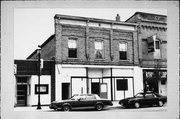 123 W MAIN ST, a Commercial Vernacular small retail building, built in Omro, Wisconsin in 1900.