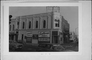 126 N MAIN ST, 5 OTTER AVE, a Italianate small retail building, built in Oshkosh, Wisconsin in 1875.