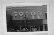 206 N MAIN ST, a Italianate retail building, built in Oshkosh, Wisconsin in 1875.