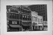 416-420 N MAIN ST, a Queen Anne small retail building, built in Oshkosh, Wisconsin in 1884.