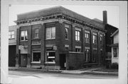 108 W 4TH ST, a Neoclassical/Beaux Arts small office building, built in Marshfield, Wisconsin in 1903.