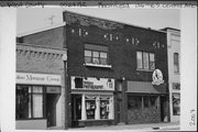 136-140 S CENTRAL AVE, a Commercial Vernacular retail building, built in Marshfield, Wisconsin in 1925.