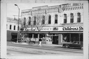 301-305 S CENTRAL AVE, a Commercial Vernacular retail building, built in Marshfield, Wisconsin in 1887.