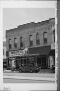 301-305 S CENTRAL AVE, a Commercial Vernacular retail building, built in Marshfield, Wisconsin in 1887.