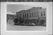 301-305 S CENTRAL AVE, a Commercial Vernacular retail building, built in Marshfield, Wisconsin in 1887.