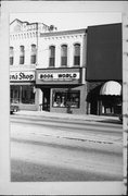 315 S CENTRAL AVE, a Commercial Vernacular small retail building, built in Marshfield, Wisconsin in 1887.