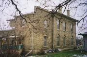 102-104 N ATWOOD AVE, a Italianate duplex/two-flat, built in Janesville, Wisconsin in 1876.