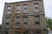 110 ALGOMA BLVD, a Romanesque Revival large office building, built in Oshkosh, Wisconsin in 1887.