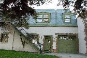 98 Fifth St, a Spanish/Mediterranean Styles boat house, built in Neenah, Wisconsin in 1932.