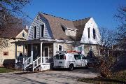408 S 1ST ST, a Dutch Colonial Revival house, built in Evansville, Wisconsin in 1900.