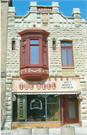 115 N ADAMS ST, a Commercial Vernacular small retail building, built in Green Bay, Wisconsin in 1894.