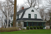 7195 HORSESHOE BAY RD, a Dutch Colonial Revival house, built in Egg Harbor, Wisconsin in 1919.