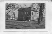 BLOCK BOUNDED BY PEARL, PARK, VINE, AND MAIN STS, a Two Story Cube village hall, built in Belleville, Wisconsin in 1894.