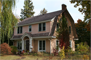 822 MACARTHUR AVE, a Dutch Colonial Revival house, built in Ashland, Wisconsin in 1924.