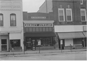 111 S MAIN ST, a Twentieth Century Commercial small retail building, built in Oregon, Wisconsin in 1878.