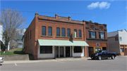 112 E BENNETT AVE, a Commercial Vernacular small retail building, built in Mellen, Wisconsin in 1907.