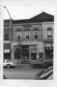 161 E MAIN ST, a Commercial Vernacular small retail building, built in Stoughton, Wisconsin in 1889.