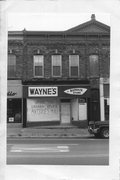 175 E MAIN, a Italianate large retail building, built in Stoughton, Wisconsin in 1889.