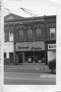 183 E MAIN ST, a Italianate large retail building, built in Stoughton, Wisconsin in 1889.