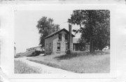 76 US Highway 14, a Gabled Ell house, built in Rutland, Wisconsin in 1850.