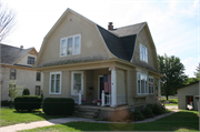 1411 WISCONSIN AVE, a Dutch Colonial Revival house, built in New Holstein, Wisconsin in 1914.