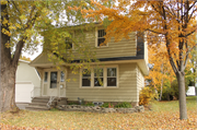 707 DERBY LN, a Dutch Colonial Revival house, built in Allouez, Wisconsin in 1939.
