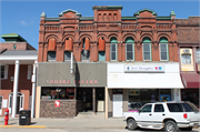 120-124 4TH AVE, a Romanesque Revival retail building, built in Baraboo, Wisconsin in 1886.