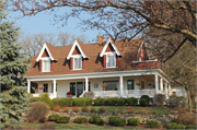 W7994 COUNTY HIGHWAY B, a Dutch Colonial Revival house, built in Lake Mills, Wisconsin in 1900.