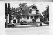 308 S MONROE ST, a Dutch Colonial Revival house, built in Stoughton, Wisconsin in 1910.