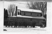 200 S MONROE ST, a Dutch Colonial Revival house, built in Stoughton, Wisconsin in 1921.