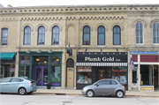 322 MAIN ST, a Italianate small retail building, built in Racine, Wisconsin in 1870.