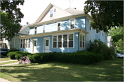 351-353 W JAMES ST, a Queen Anne duplex/two-flat, built in Columbus, Wisconsin in 1920.