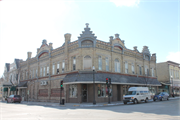 225-227 E MILL ST, a German Renaissance Revival large retail building, built in Plymouth, Wisconsin in 1889.