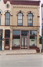 1001-1005 16TH AVE, a Italianate retail building, built in Monroe, Wisconsin in 1872.