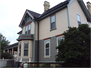 1222 11TH ST, a Queen Anne house, built in Monroe, Wisconsin in 1880.