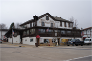 100 6TH AVENUE, a Greek Revival lodging-hotel, built in New Glarus, Wisconsin in 1853.