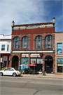 103-105 S MAIN ST, a Romanesque Revival retail building, built in Lake Mills, Wisconsin in 1895.