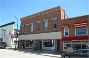 112 S MAIN ST, a Commercial Vernacular large retail building, built in Lake Mills, Wisconsin in 1907.