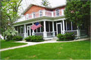 317 W MAIN ST, a Gabled Ell house, built in Waunakee, Wisconsin in 1855.