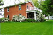 317 W MAIN ST, a Gabled Ell house, built in Waunakee, Wisconsin in 1855.